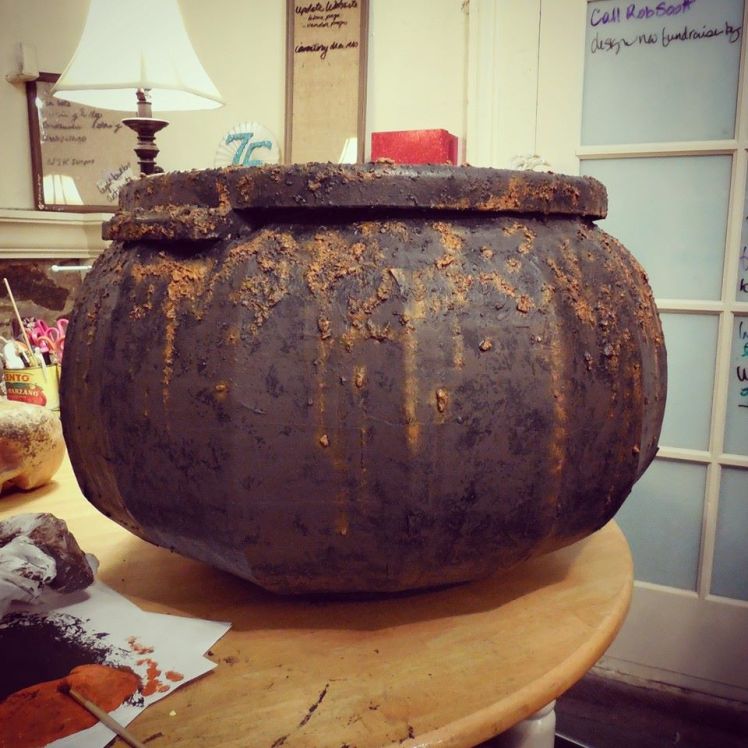 The finished rusty cauldron waiting for a skull base and tissue paper "fire".